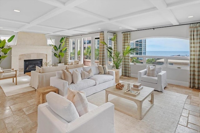 sunroom with coffered ceiling, a fireplace, and beamed ceiling