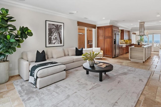 living area featuring baseboards, ornamental molding, recessed lighting, and stone tile floors