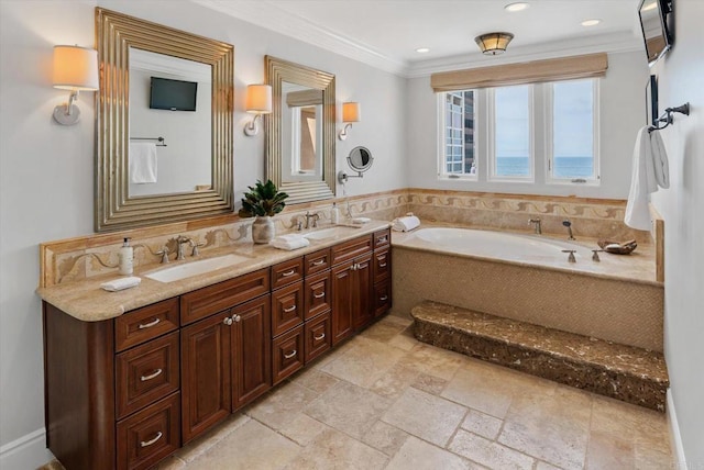 bathroom with a garden tub, double vanity, a sink, and crown molding