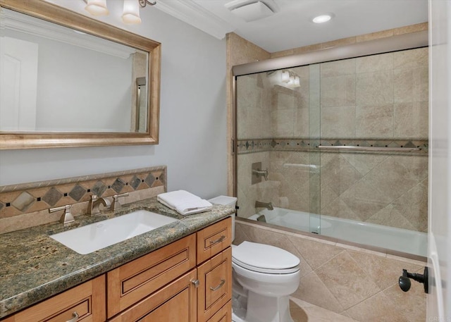 full bath with toilet, ornamental molding, tiled shower / bath, vanity, and backsplash