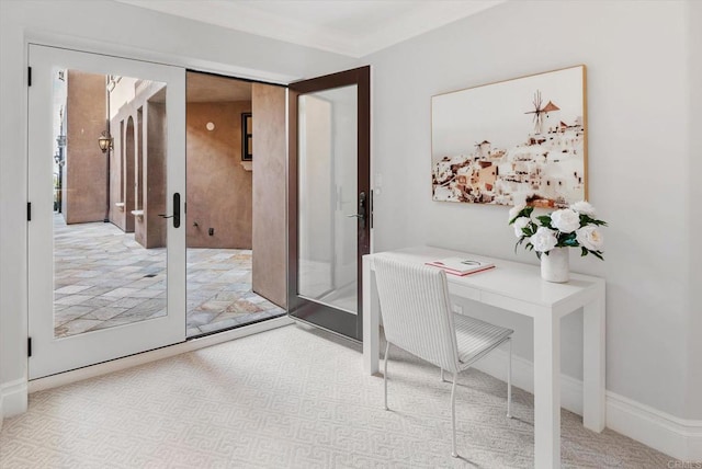 office space with ornamental molding and french doors