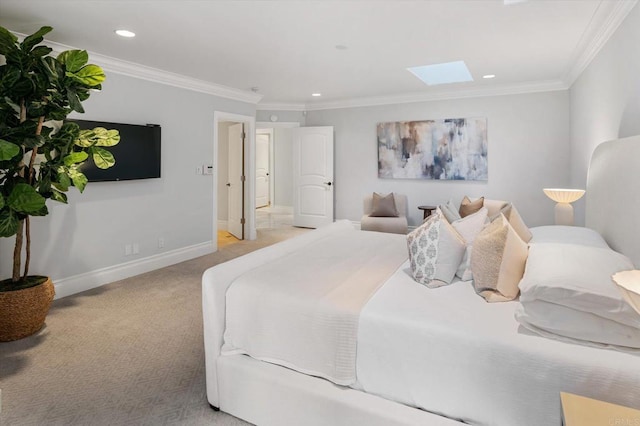 bedroom featuring a skylight, carpet, baseboards, and ornamental molding