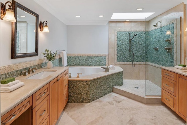 bathroom featuring a skylight, tiled shower, a garden tub, vanity, and recessed lighting