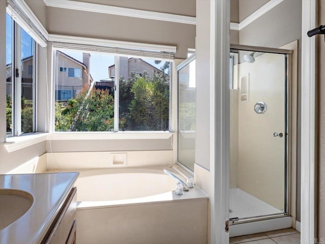 full bath with a garden tub, a shower stall, vanity, and tile patterned floors