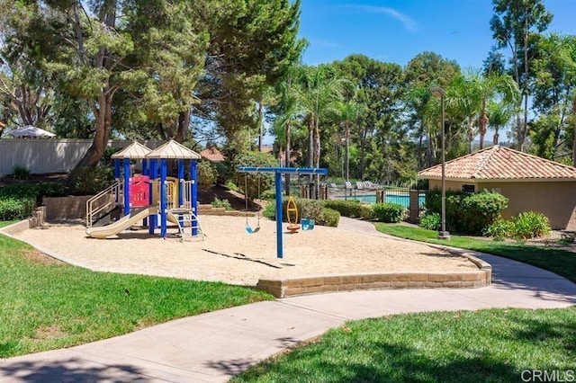 communal playground featuring fence