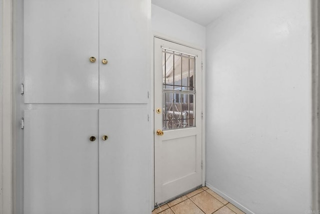 doorway to outside featuring light tile patterned floors