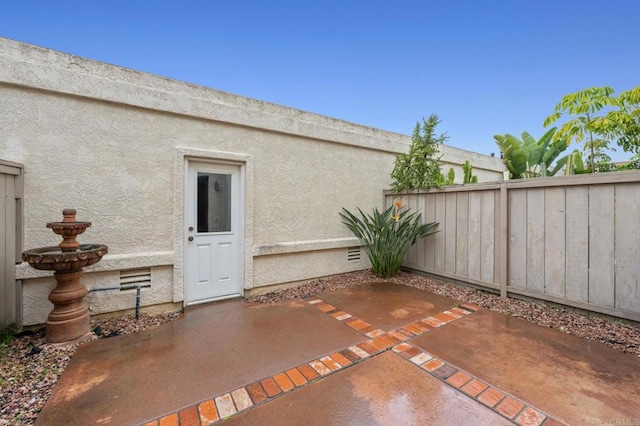 view of patio / terrace featuring fence