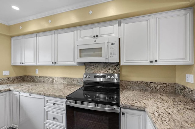 kitchen with light stone countertops, ornamental molding, recessed lighting, white appliances, and white cabinetry