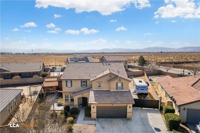 birds eye view of property with a mountain view