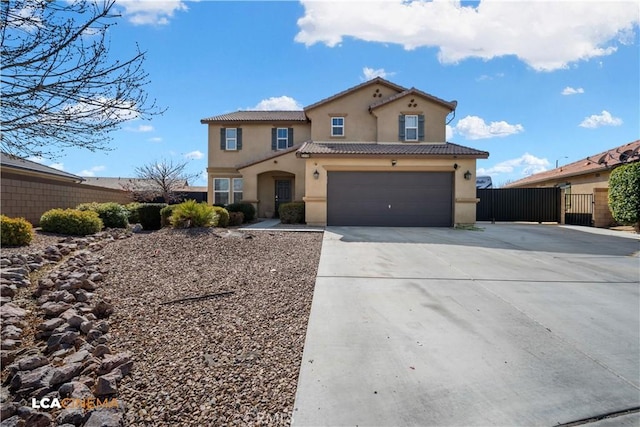 mediterranean / spanish house featuring stucco siding, an attached garage, fence, driveway, and a tiled roof