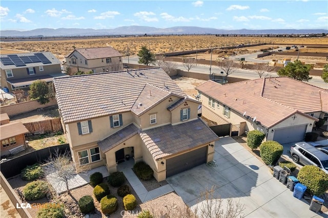 aerial view with a residential view, a desert view, and a mountain view