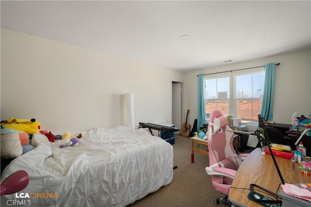 carpeted bedroom featuring visible vents