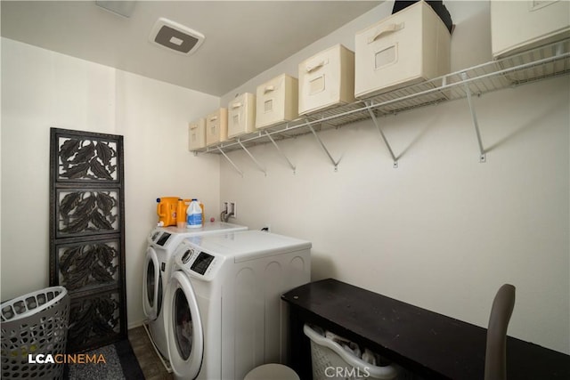 washroom featuring laundry area and washer and dryer