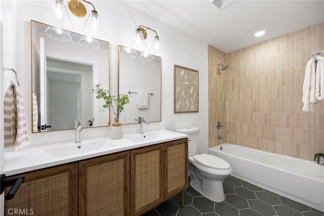 full bathroom with toilet, a sink, shower / bathtub combination, and double vanity