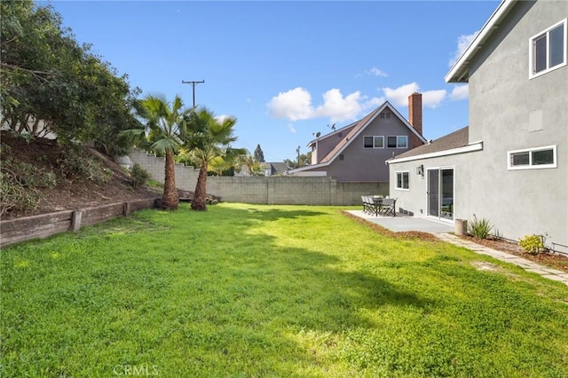 view of yard featuring a patio area and fence