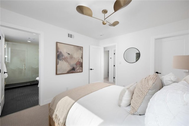 bedroom with carpet, ensuite bath, and visible vents