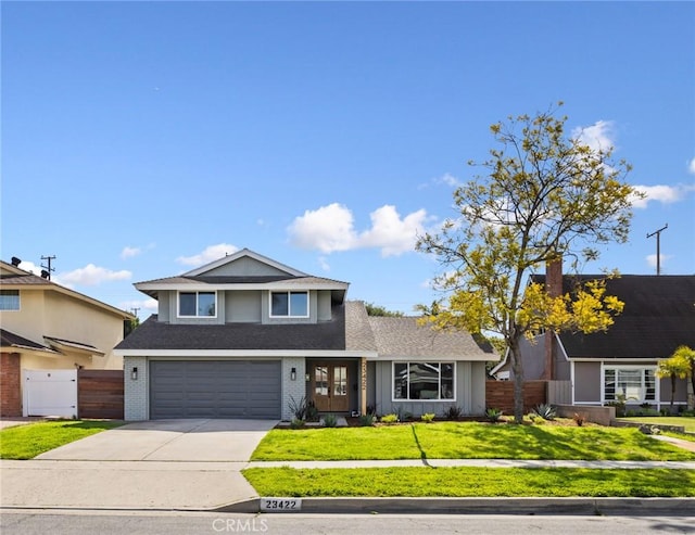 view of front of property featuring a garage, brick siding, fence, driveway, and a front yard