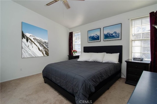 bedroom with ceiling fan and light colored carpet