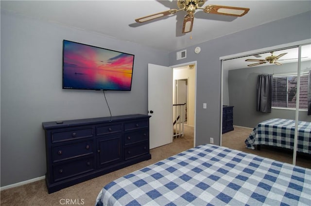 bedroom featuring a ceiling fan, carpet, a closet, and visible vents