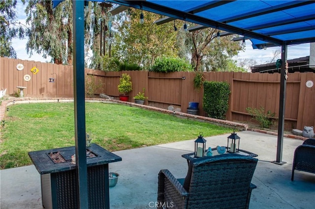 view of patio featuring a fire pit and a fenced backyard