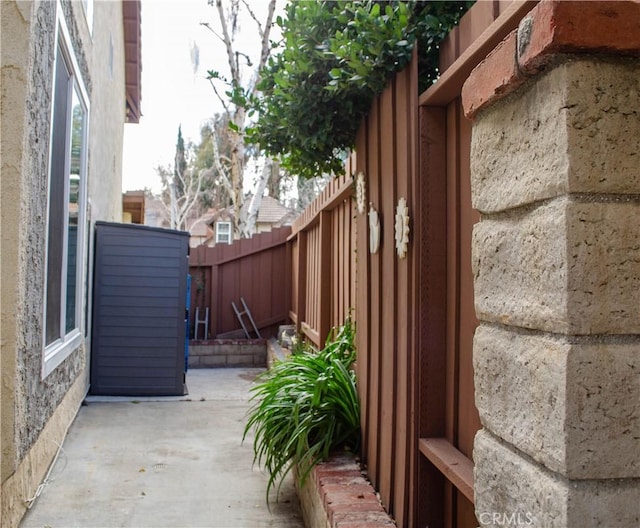 view of property exterior featuring a patio area and a fenced backyard