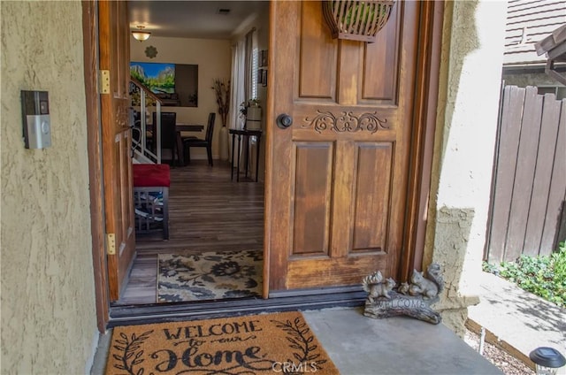 doorway to property with stucco siding