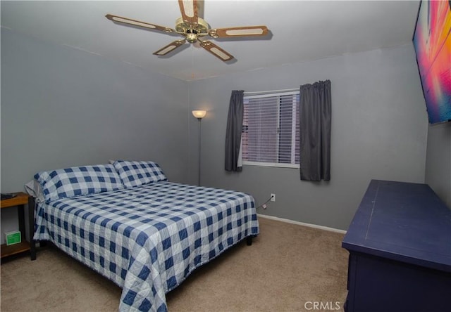 bedroom with ceiling fan, carpet flooring, and baseboards