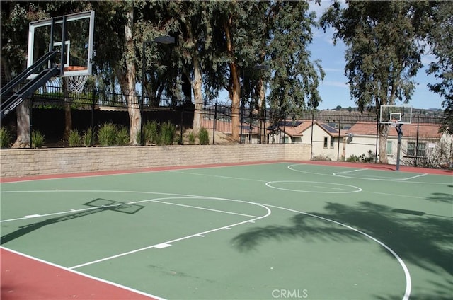 view of sport court with community basketball court and fence