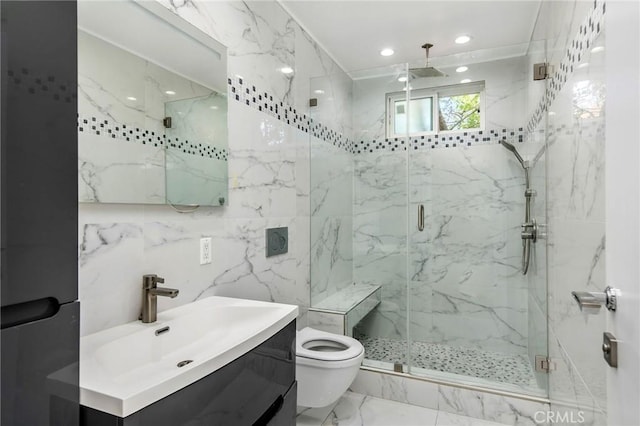bathroom featuring toilet, marble finish floor, vanity, a shower stall, and recessed lighting