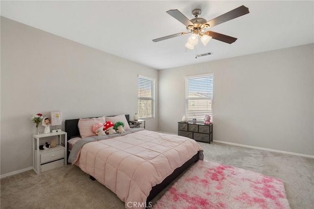 bedroom featuring a ceiling fan, light carpet, visible vents, and baseboards