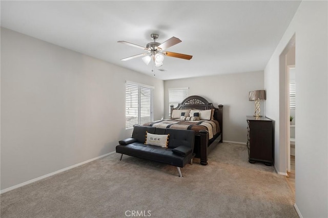 bedroom with baseboards, ceiling fan, and light colored carpet