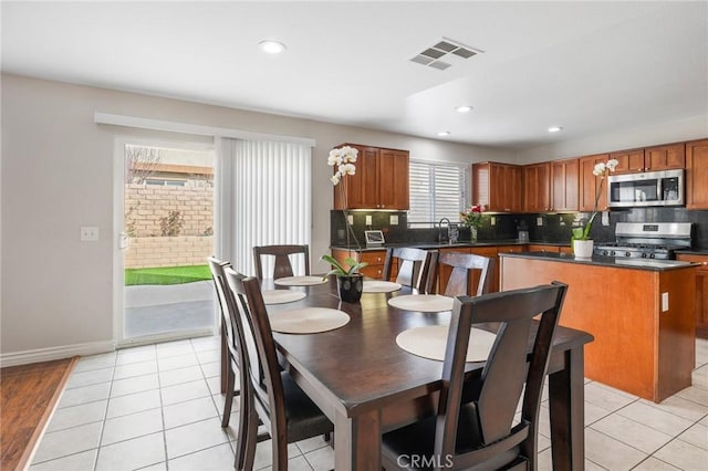 dining space featuring recessed lighting, visible vents, baseboards, and light tile patterned floors