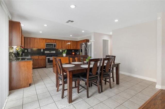 dining area featuring recessed lighting, visible vents, and light tile patterned floors