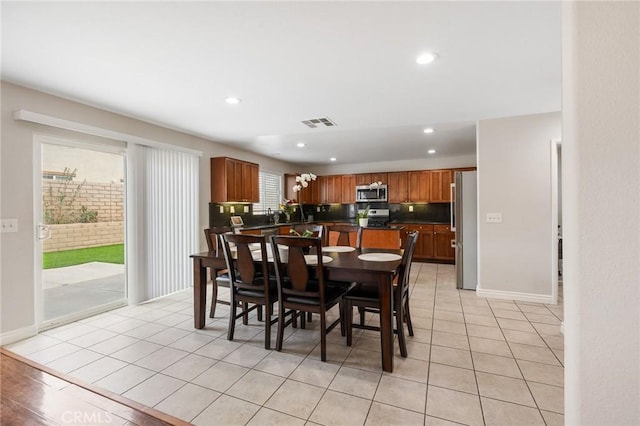 dining area with light tile patterned floors, baseboards, visible vents, and recessed lighting