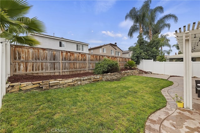 view of yard with a fenced backyard