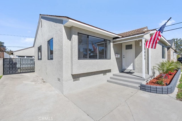 view of front of property featuring crawl space and stucco siding