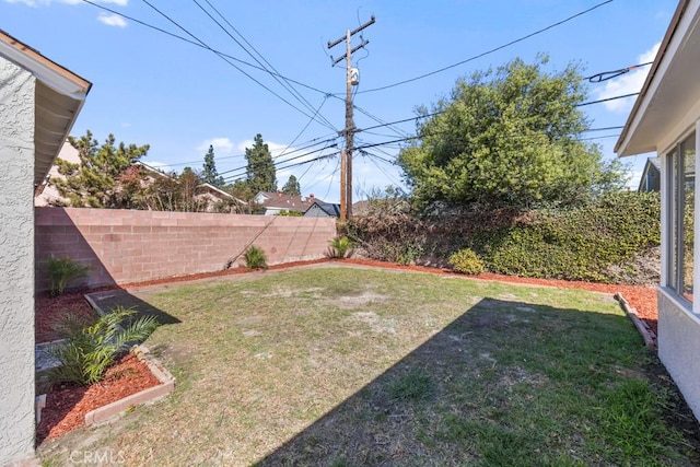 view of yard with a fenced backyard