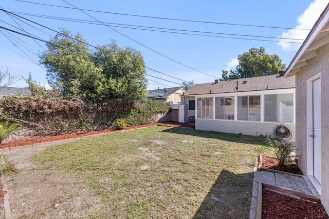 view of yard with a sunroom