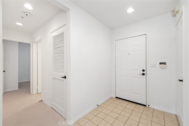 interior space with recessed lighting and baseboards