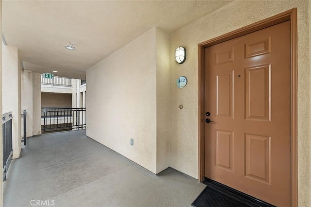 view of exterior entry featuring stucco siding