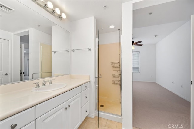 full bathroom with vanity, a ceiling fan, visible vents, a shower stall, and tile patterned floors