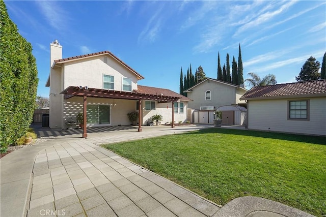 back of property with a tile roof, a pergola, a chimney, a storage unit, and a patio