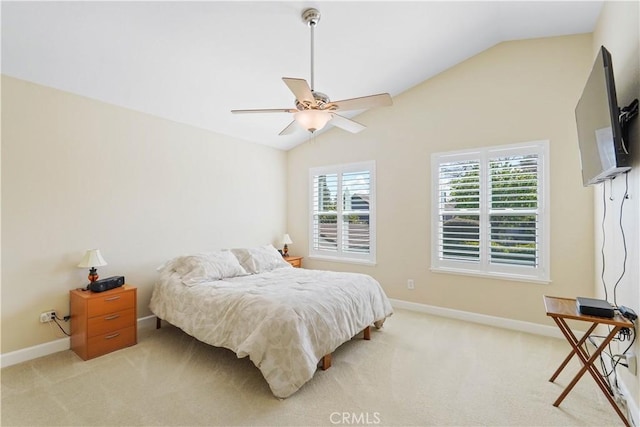 bedroom with light carpet, baseboards, lofted ceiling, and a ceiling fan