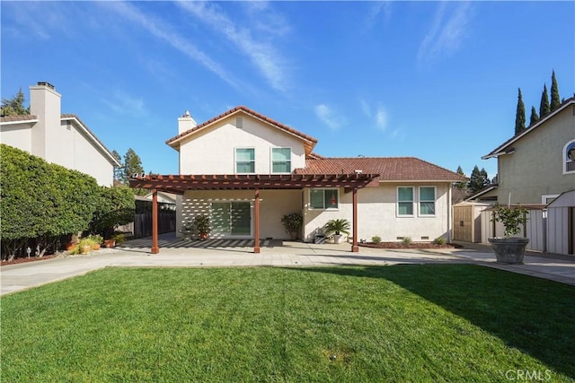 rear view of property with stucco siding, a tiled roof, a pergola, and fence