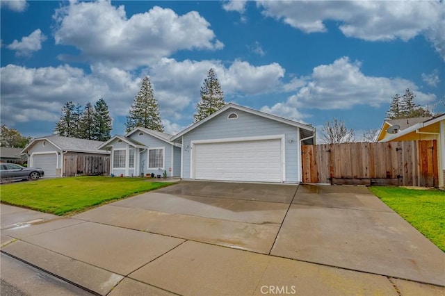 single story home with an attached garage, concrete driveway, a front yard, and fence