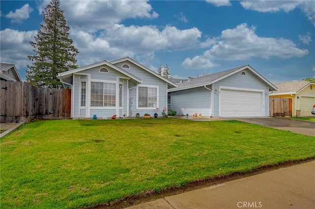 view of front of house with driveway, a front lawn, an attached garage, and fence