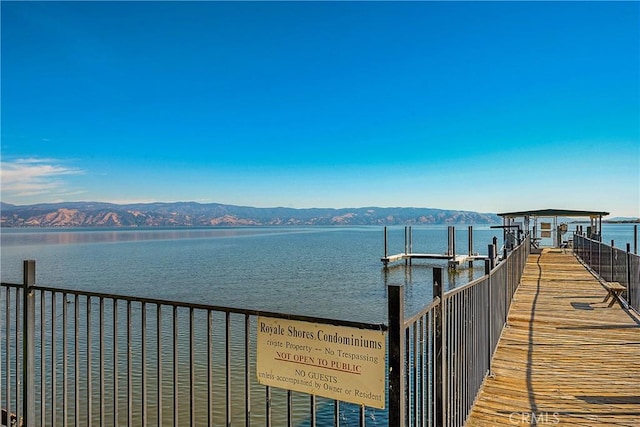 dock area featuring a water and mountain view