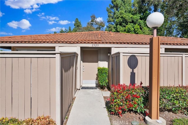 exterior space with a tile roof