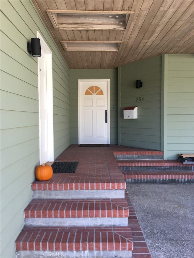property entrance featuring covered porch