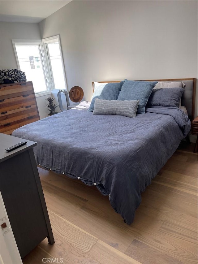 bedroom featuring light wood-style floors